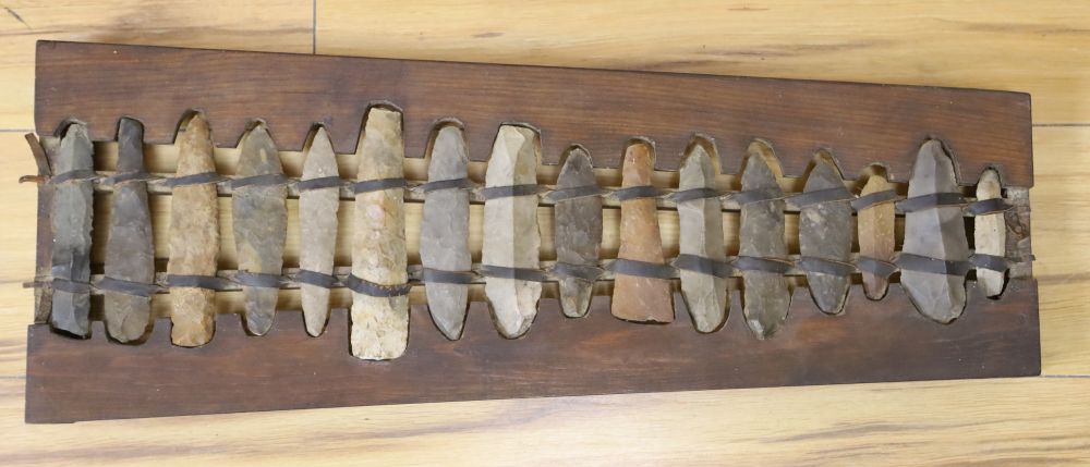 A xylophone formed from Stone Age flints, length 60cm